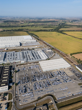Aerial view of the Volkswagen plant near Devinska Nova Ves with large industrial buildings and parking lots filled with new cars in Bratislava Bratislavsky kraj Slovakia. Aerial view of the Volkswagen plant near Devinska Nova Ves with large industrial buildings and parking lots filled with new cars in Bratislava Bratislavsky kraj Slovakia.