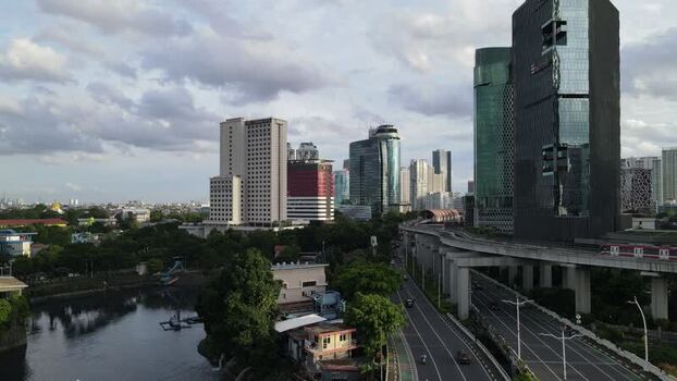 Aerial view of Jakarta skyline with skyscrapers and LRT Indonesia. Aerial view of Jakarta skyline with skyscrapers and LRT Indonesia.