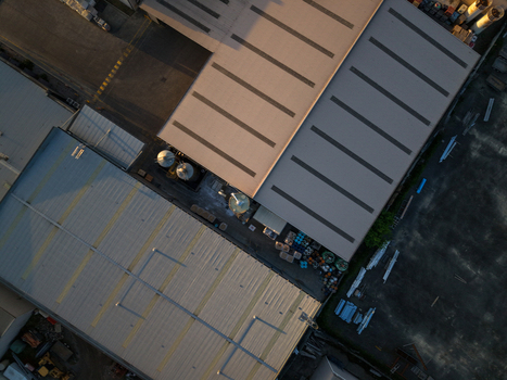 Aerial view of industrial factory buildings with metal roofs and storage tanks in Kilsyth South Melbourne VIC Australia. Aerial view of industrial factory buildings with metal roofs and storage tanks in Kilsyth South Melbourne VIC Australia.