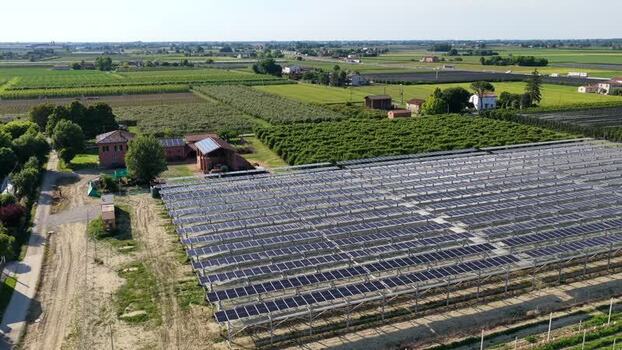 Aerial view of solar farm in rural landscape Italy.