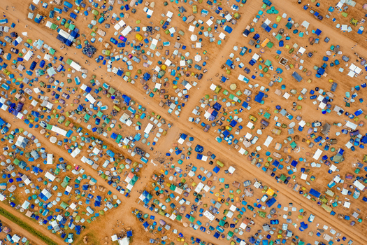 Aerial view of the Open Beatz Festival campsite with rows of colorful tents on sandy ground in Herzogenaurach Bayern Germany. Aerial view of the Open Beatz Festival campsite with rows of colorful tents on sandy ground in Herzogenaurach Bayern Germany.