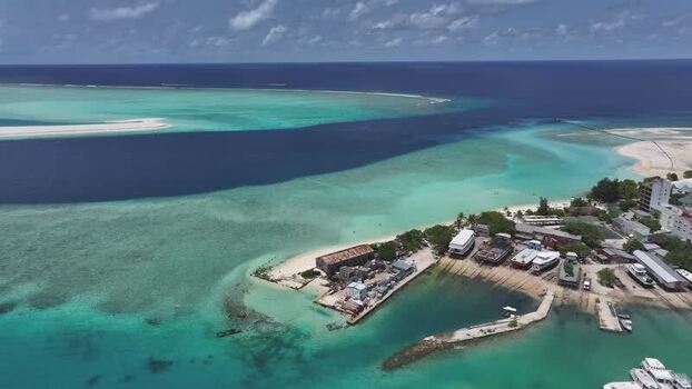 Aerial view of Gulhi island and turquoise lagoon Maldives. Aerial view of Gulhi island and turquoise lagoon Maldives.