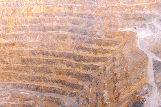 Geamana Romania 21 September 2026 Aerial view of the open pit mine at Geamana showing terraced rock walls winding access roads and the vast scale of the industrial excavation site. Geamana Romania 21 September 2026 Aerial view of the open pit mine at Geamana showing terraced rock walls winding access roads and the vast scale of the industrial excavation site.