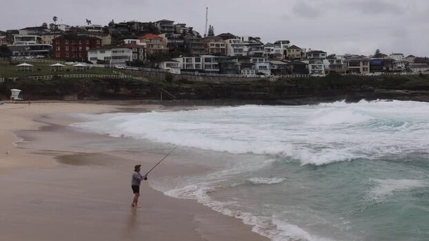 View of a fisherman at Bondi Beach Australia.