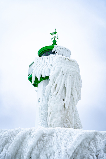 View of Molenfeuer Sassnitz covered in thick layers of ice and icicles during a cold winter day in Sassnitz Mecklenburg Vorpommern Germany.
