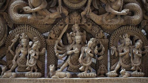 View of intricate traditional wood carvings of deities Nepal.