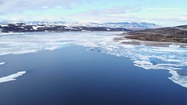 Aerial view of Hardangervidda lake and snowy mountains Norway. Aerial view of Hardangervidda lake and snowy mountains Norway.