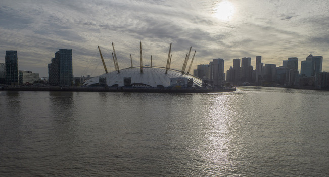 Aerial view of The O2 formerly known as the Millennium Dome situated on the Greenwich Peninsula along the River Thames in London England United Kingdom. Aerial view of The O2 formerly known as the Millennium Dome situated on the Greenwich Peninsula along the River Thames in London England United Kingdom.