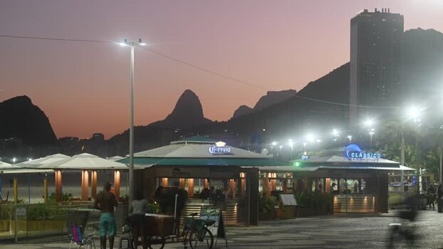 View of kiosks at Copacabana Beach at dusk Brazil.