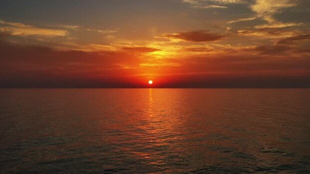 Aerial view of sunset over the calm sea in Montenegro. Aerial view of sunset over the calm sea in Montenegro.
