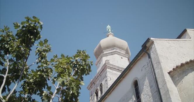View of Krk Cathedral bell tower in Krk Croatia. View of Krk Cathedral bell tower in Krk Croatia.