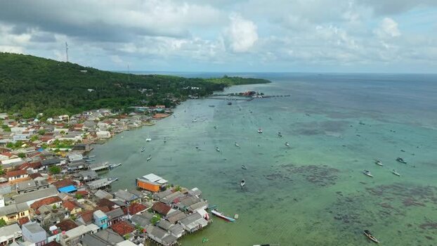 Aerial view of houses and boats Karimunjawa Indonesia. Aerial view of houses and boats Karimunjawa Indonesia.