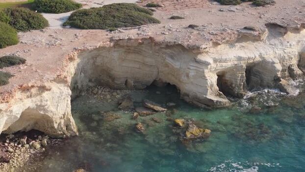 Aerial view of sea caves along the coast of Cyprus.
