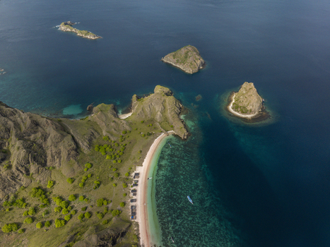 Aerial view of Pink Beach with its unique pink sand turquoise waters and surrounding rocky islands East Nusa Tenggara Indonesia. Aerial view of Pink Beach with its unique pink sand turquoise waters and surrounding rocky islands East Nusa Tenggara Indonesia.