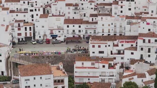 Aerial view of white washed houses and central square Spain. Aerial view of white washed houses and central square Spain.