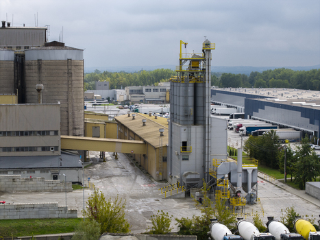 Aerial view of the bituminous mass factory with industrial silos concrete mixing trucks and warehouses in Krakow Lesser Poland Voivode Poland.
