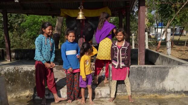 View of young girls at a village shrine in Nepal.