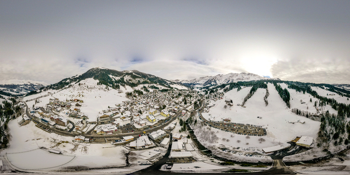 Aerial view of the village of Soerenberg within the UNESCO Biosphare Entlebuch surrounded by snow covered mountains and ski slopes Soerenberg Luzern Switzerland. Aerial view of the village of Soerenberg within the UNESCO Biosphare Entlebuch surrounded by snow covered mountains and ski slopes Soerenberg Luzern Switzerland.