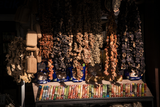 View of strings of dried eggplants peppers and okra hanging in a traditional market stall with dramatic sunlight Kayseri Kayseri Turkiye. View of strings of dried eggplants peppers and okra hanging in a traditional market stall with dramatic sunlight Kayseri Kayseri Turkiye.