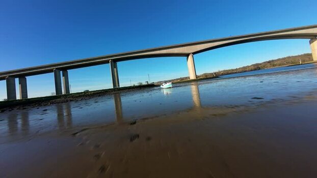 Aerial FPV view of river and mudflat United Kingdom. Aerial FPV view of river and mudflat United Kingdom.