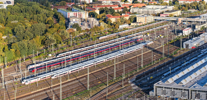 Berlin Germany 20 September 2026 Aerial view of ICE Werk Berlin Rummelsburg showing high speed trains on tracks surrounded by industrial buildings trees and urban infrastructure. Berlin Germany 20 September 2026 Aerial view of ICE Werk Berlin Rummelsburg showing high speed trains on tracks surrounded by industrial buildings trees and urban infrastructure.