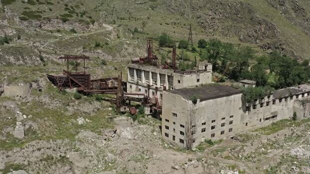Aerial view of abandoned factory in Caucasus Mountains Russia.
