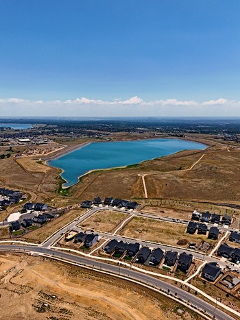 Aerial view of Leyden Reservoir and surrounding suburban housing developments set within the dry landscape of Jefferson County Colorado United States. Aerial view of Leyden Reservoir and surrounding suburban housing developments set within the dry landscape of Jefferson County Colorado United States.