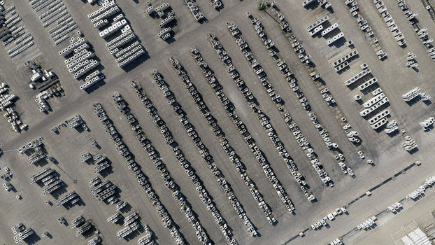 Aerial view of rows of concrete blocks and building materials arranged in an industrial storage yard under bright daylight in Oosterhout North Brabant Netherlands. Aerial view of rows of concrete blocks and building materials arranged in an industrial storage yard under bright daylight in Oosterhout North Brabant Netherlands.