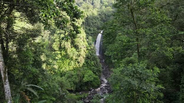 Aerial view of Gomblang Waterfall in the lush jungle Indonesia.