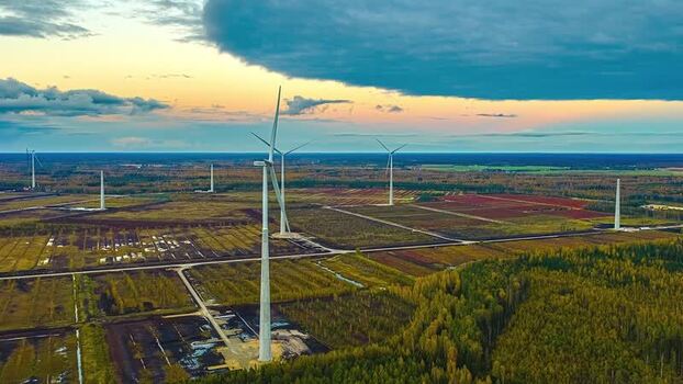 Aerial view of wind turbines in a rural landscape in Latvia. Aerial view of wind turbines in a rural landscape in Latvia.