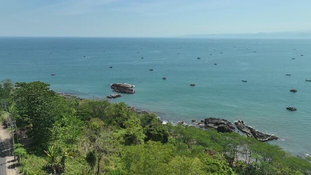 Aerial view of coastal road and sea in Indonesia. Aerial view of coastal road and sea in Indonesia.