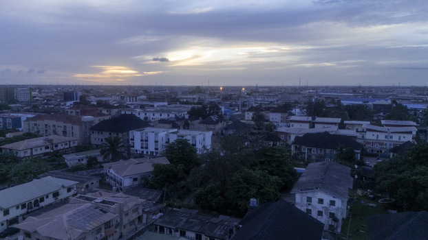 Aerial view of Allen Avenue area featuring urban buildings and residential rooftops under a twilight sky at sunset in Ikeja Lagos Nigeria. Aerial view of Allen Avenue area featuring urban buildings and residential rooftops under a twilight sky at sunset in Ikeja Lagos Nigeria.