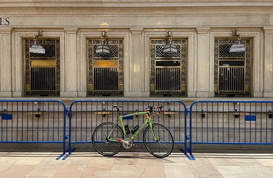 New York United States 14 May 2026 View of a lime green road bike parked in front of the historic ornate ticket windows at Grand Central Terminal. New York United States 14 May 2026 View of a lime green road bike parked in front of the historic ornate ticket windows at Grand Central Terminal.