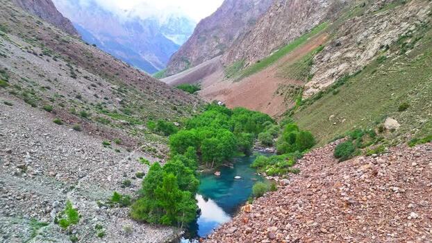 Aerial view of the turquoise river and Vudor Peak Tajikistan. Aerial view of the turquoise river and Vudor Peak Tajikistan.