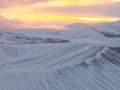 Aerial view of Hverfjall volcanic crater covered in snow during golden hour Thingeyjarsveit Iceland. Aerial view of Hverfjall volcanic crater covered in snow during golden hour Thingeyjarsveit Iceland.