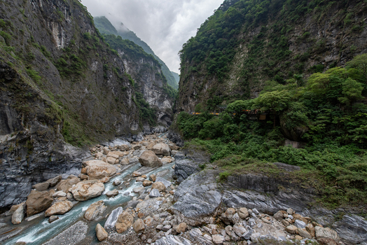 View of the dramatic Taroko Gorge with its steep marble cliffs turquoise river and large boulders in Taroko National Park Xiulin Township Hualien County Taiwan.