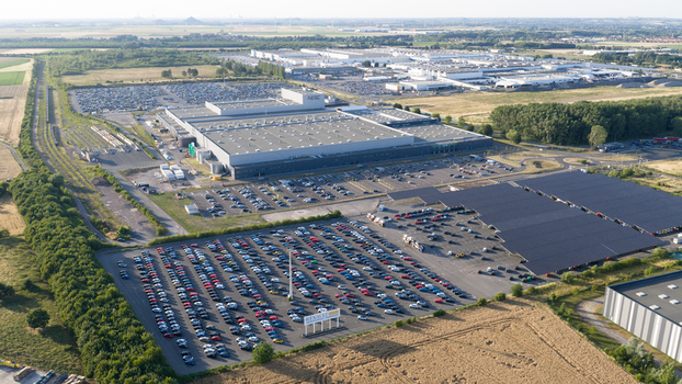Lambres lez Douai France 07 July 2026 Aerial view of the AESC France battery plant featuring large industrial buildings extensive car parking and solar panel arrays.