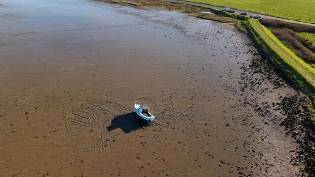Aerial view of boat at low tide Ipswich United Kingdom.