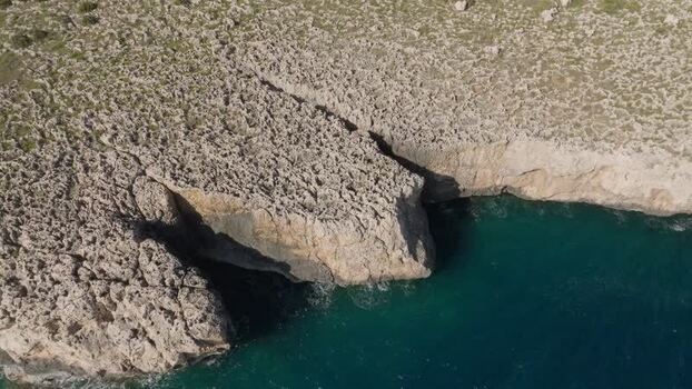 Aerial view of the rugged Plemmirio coastline and cliffs Italy.