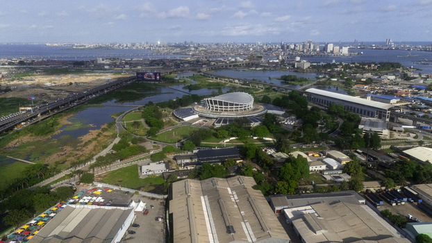 Aerial view of the Wole Soyinka Centre for Culture and Creative Arts National Theatre Nigeria featuring its unique circular design and surrounding greenery in Lagos Lagos Nigeria. Aerial view of the Wole Soyinka Centre for Culture and Creative Arts National Theatre Nigeria featuring its unique circular design and surrounding greenery in Lagos Lagos Nigeria.