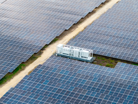Aerial view of a large scale solar photovoltaic power plant with rows of solar panels and an electrical substation situated in Central Seberang Perai Penang Malaysia. Aerial view of a large scale solar photovoltaic power plant with rows of solar panels and an electrical substation situated in Central Seberang Perai Penang Malaysia.