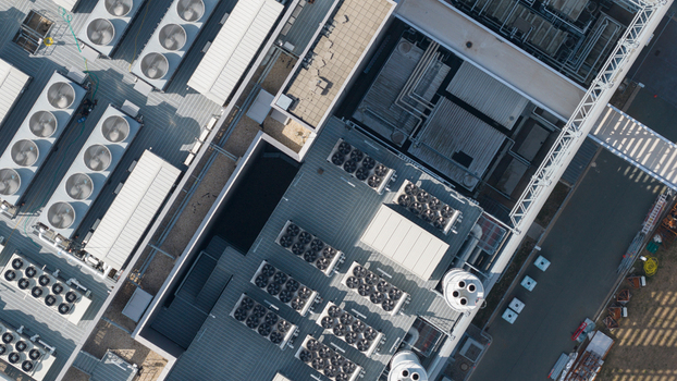 Aerial view of the Equinix Data Center roof featuring numerous industrial HVAC cooling units and ventilation systems in Frankfurt am Main Hessen Germany.