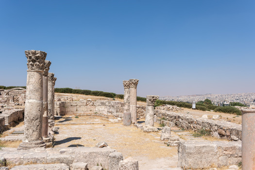 View of Amman Citadel featuring ancient stone columns and ruins under a clear blue sky in Amman Amman Governorate Jordan.
