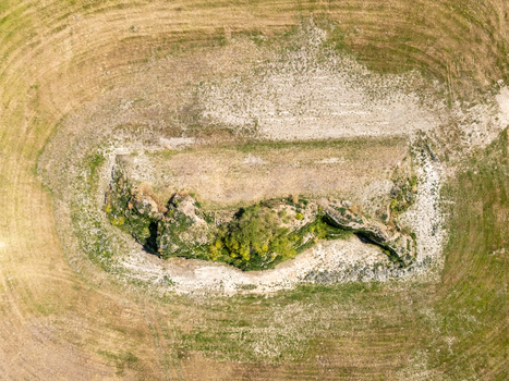 Aerial view of the Dijk van een wijf earthwork structure surrounded by agricultural fields in Oosterbierum Friesland Netherlands. Aerial view of the Dijk van een wijf earthwork structure surrounded by agricultural fields in Oosterbierum Friesland Netherlands.