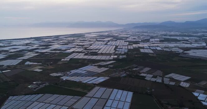 Aerial view of vast greenhouses near the coast Italy.