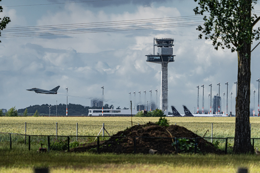 Berlin Germany 13 June 2026 View of a Eurofighter Typhoon jet performing a flight demonstration at the ILA Berlin Air Show with the control tower and parked aircraft. Berlin Germany 13 June 2026 View of a Eurofighter Typhoon jet performing a flight demonstration at the ILA Berlin Air Show with the control tower and parked aircraft.