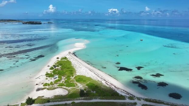 Aerial view of a tropical sandbar and turquoise lagoon Maldives.