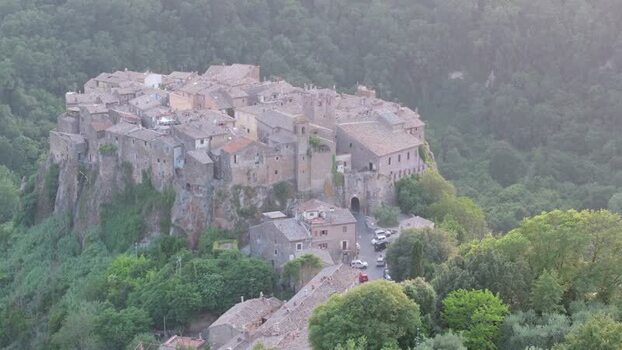 Aerial view of Calcata village on a cliff in Italy. Aerial view of Calcata village on a cliff in Italy.