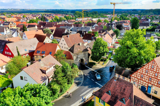 Aerial view of the historic town center with red tiled rooftops half timbered houses and the stone gate in Neunkirchen am Brand Bavaria Germany. Aerial view of the historic town center with red tiled rooftops half timbered houses and the stone gate in Neunkirchen am Brand Bavaria Germany.