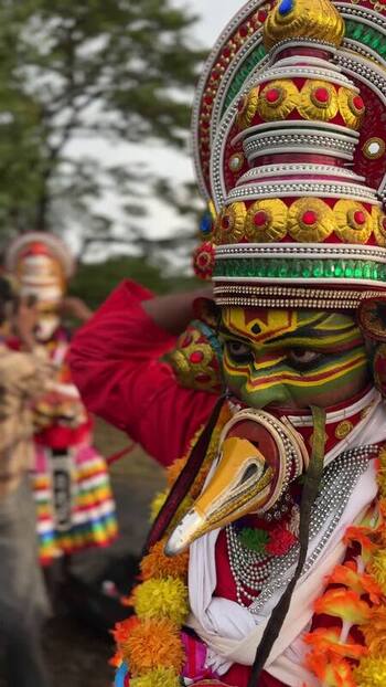 View of a Kathakali performer in traditional costume in Kochi India. View of a Kathakali performer in traditional costume in Kochi India.
